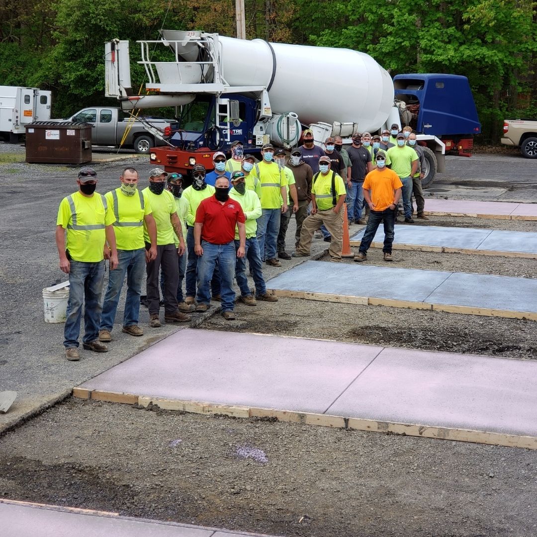 Group of approximately 20 PennDOT employees pose for a photo during the concrete finishers training. All employees are masked to protect against COVID-19.